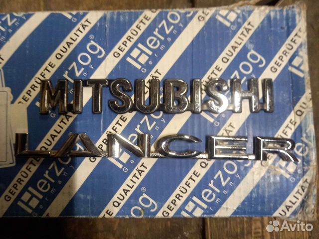 Митсубиси лансер 10 шильдики багажника